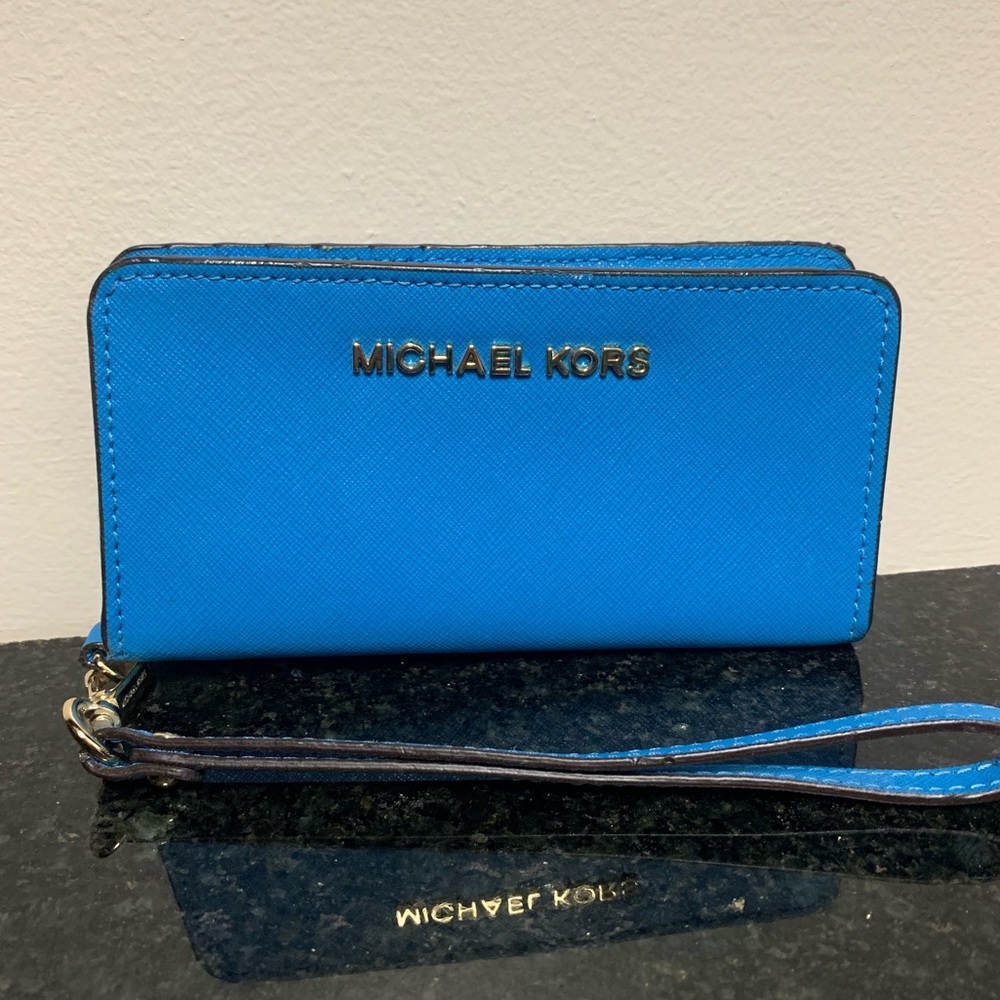 Michael Kors blue wristlet snap closure